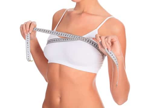 Slim woman in white underwear with tape measure, copyspace