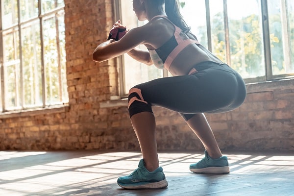 Woman in workout clothes, working out